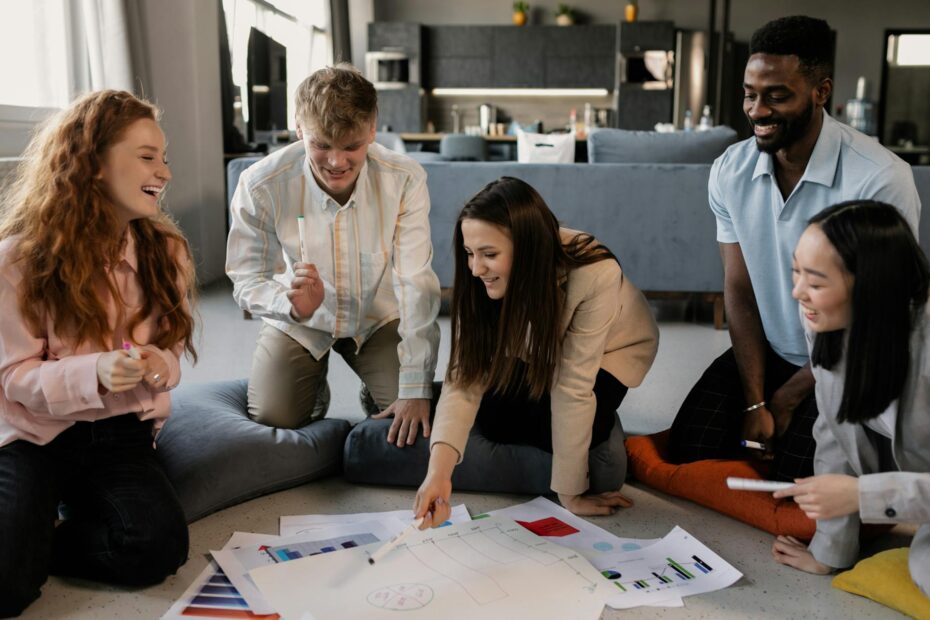 A diverse group of professionals collaborating on a project in a modern office setting.
