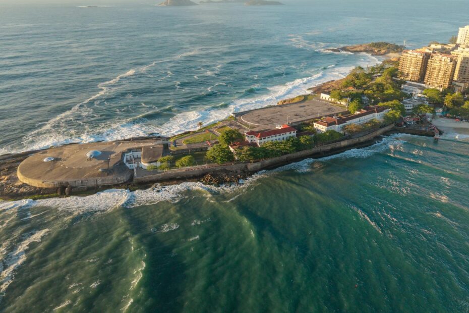 A stunning aerial view of Fort Copacabana island surrounded by the sea in Rio de Janeiro, Brazil.