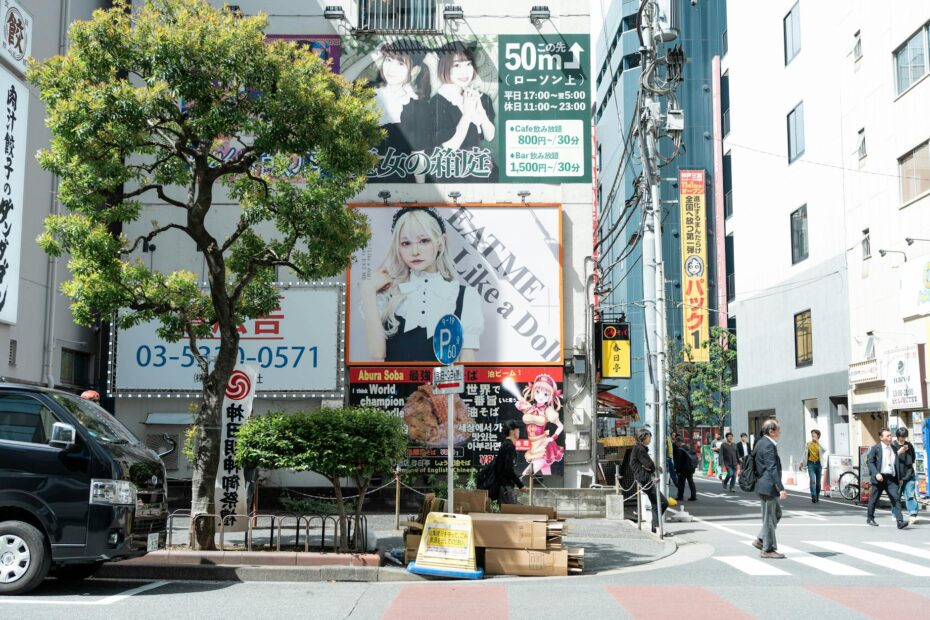 A vibrant street scene in Tokyo Japan featuring colorful billboards and pedestrians on a sunny day.