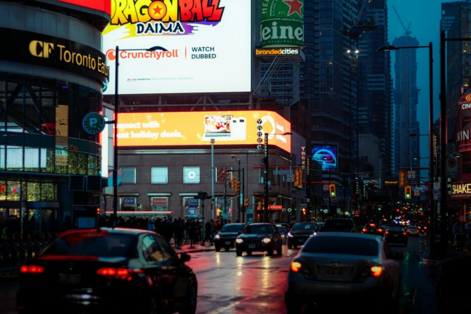 Dynamic city street scene in Toronto with vibrant billboards and bustling traffic.