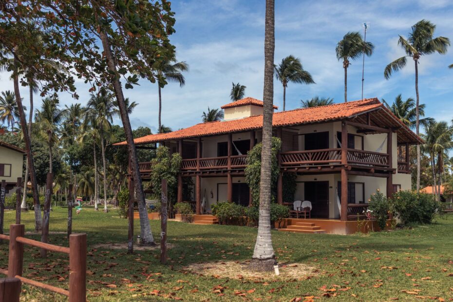 Charming beach house surrounded by palm trees in Morro de São Paulo, Brazil.