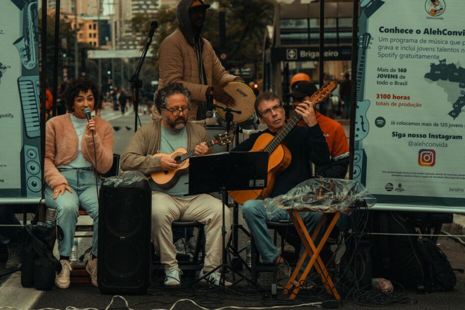 Live street performance with a band of musicians playing instruments in a urban setting.